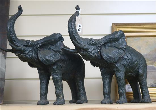 A pair of cast iron elephants height 37cm